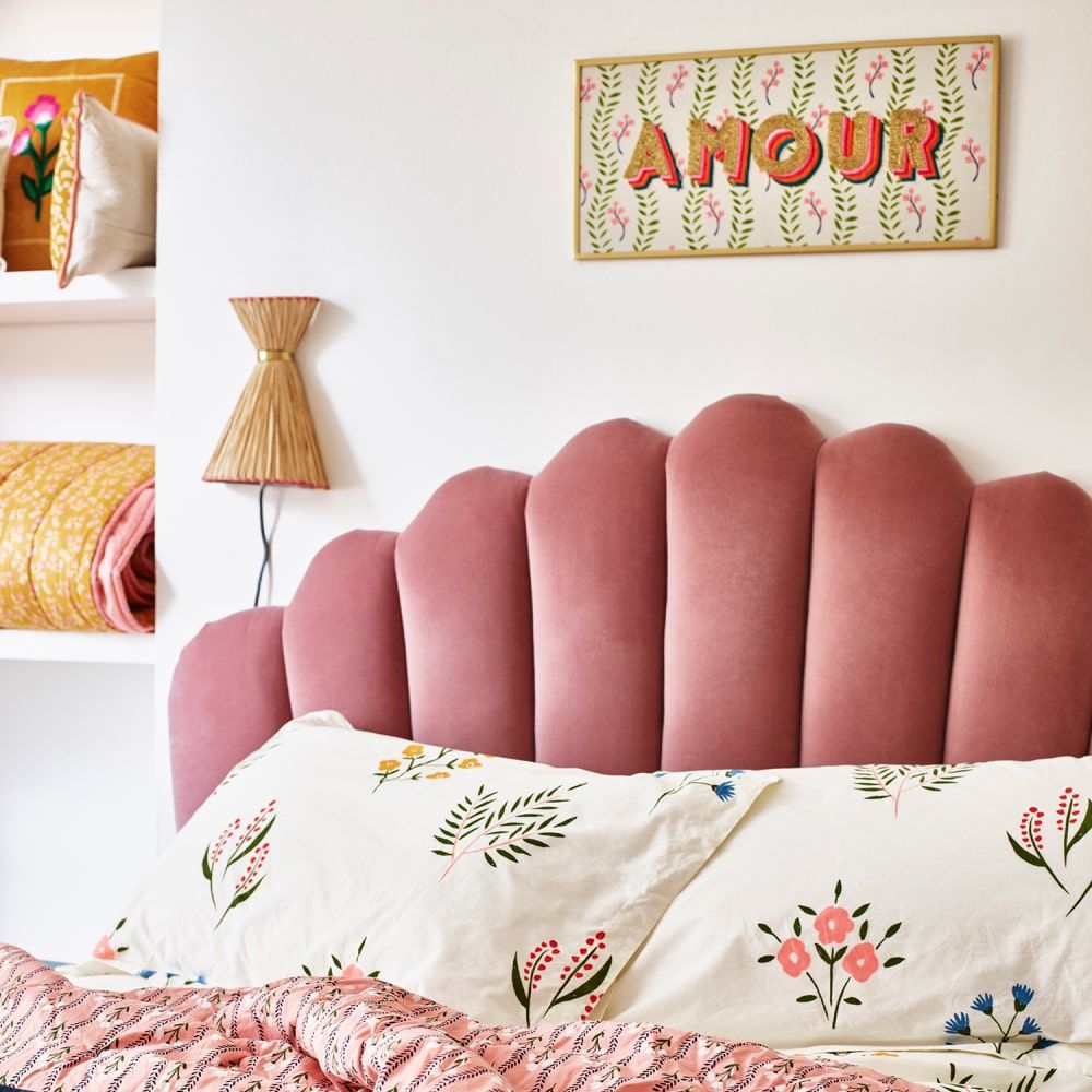 Bedroom with a pink headboard